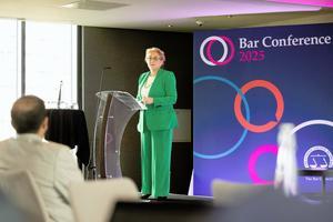 A photo of Lady Chief Justice Baroness Carr speaking at a podium on stage